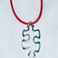 Floating Puzzle Piece Pendant