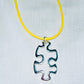 Floating Puzzle Piece Pendant
