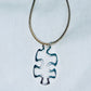Floating Puzzle Piece Pendant